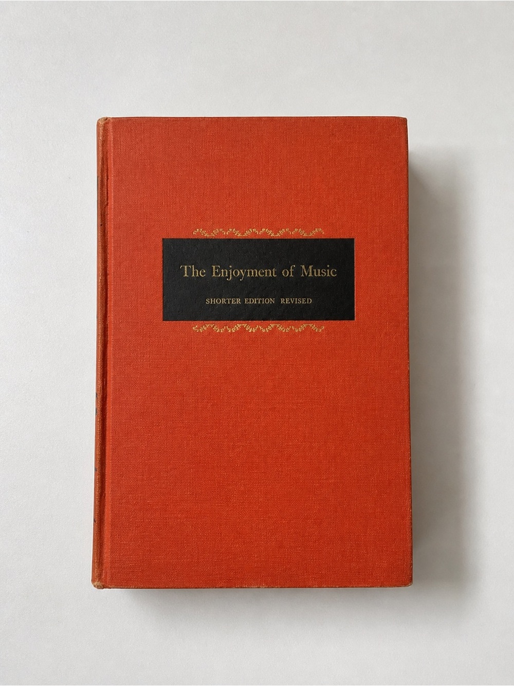 The Enjoyment of Music Hardcover Book - Orange Cover